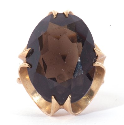 Lot 9 - 9ct gold and quartz dress ring, the oval...