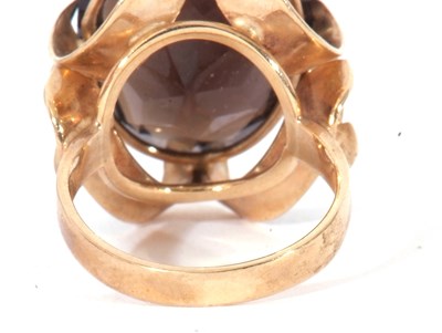 Lot 9 - 9ct gold and quartz dress ring, the oval...