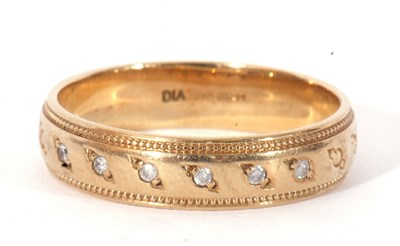 Lot 21 - Modern 9ct gold and small diamond band, the...