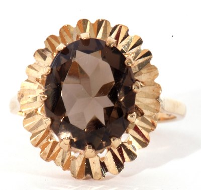 Lot 58 - 9ct gold smoky quartz dress ring, the oval...
