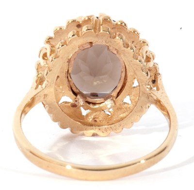 Lot 58 - 9ct gold smoky quartz dress ring, the oval...