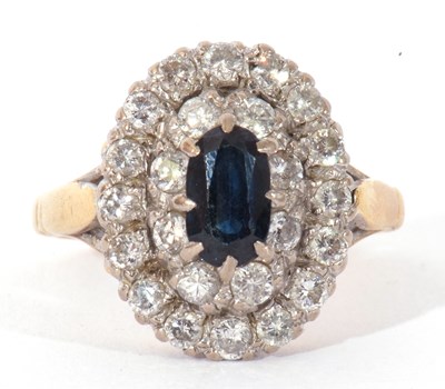 Lot 74 - Sapphire and diamond cluster ring centring an...