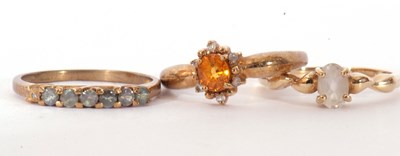 Lot 112 - Three modern 9ct gold dress rings, coloured...