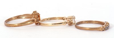 Lot 112 - Three modern 9ct gold dress rings, coloured...