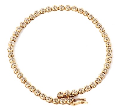Lot 166 - 9ct gold diamond set line bracelet featuring...