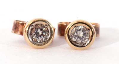 Lot 180 - Pair of 9ct gold diamond stud earrings, the...