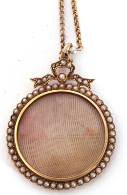 Lot 200 - Antique circular locket, framed within a seed...