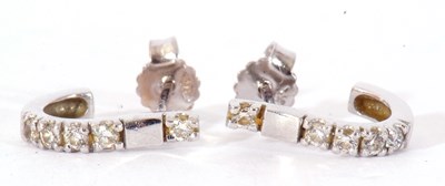 Lot 210 - Pair of diamond set half hoop earrings, each...