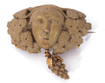 Lot 247 - Antique lava brooch in relief a head between...