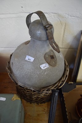 Lot 631 - ALUMINIUM CARBOY TYPE BOTTLE WITH WICKER FRAME