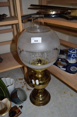 Lot 569 - BRASS BASED OIL LAMP WITH FROSTED GLASS SHADE