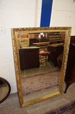 Lot 263 - A MODERN RETANGULAR BEVELED WALL MIRROR IN...