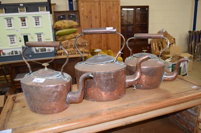 Lot 343 - THREE COPPER KETTLES