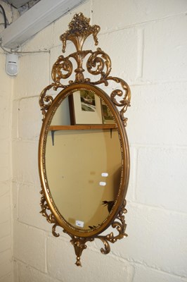 Lot 407 - CONTEMPORARY OVAL WALL MIRROR IN GILT EFFECT...