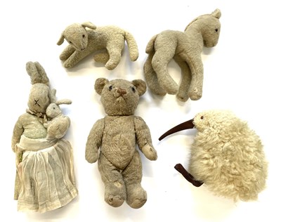 Lot 101 - A collection of vintage soft toys to include: -...