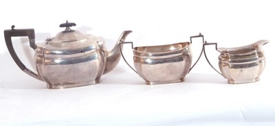 Lot 22 - George V silver three piece tea set of plain...