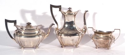 Lot 49 - Edward VII silver three piece tea set of oval...