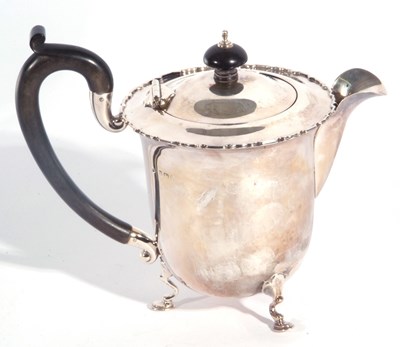 Lot 55 - George V silver teapot of circular form having...