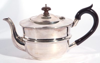 Lot 57 - George V silver teapot of slight compressed...