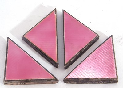 Lot 90 - Group of four Art Deco silver pink and enamel...