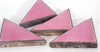 Lot 90 - Group of four Art Deco silver pink and enamel...