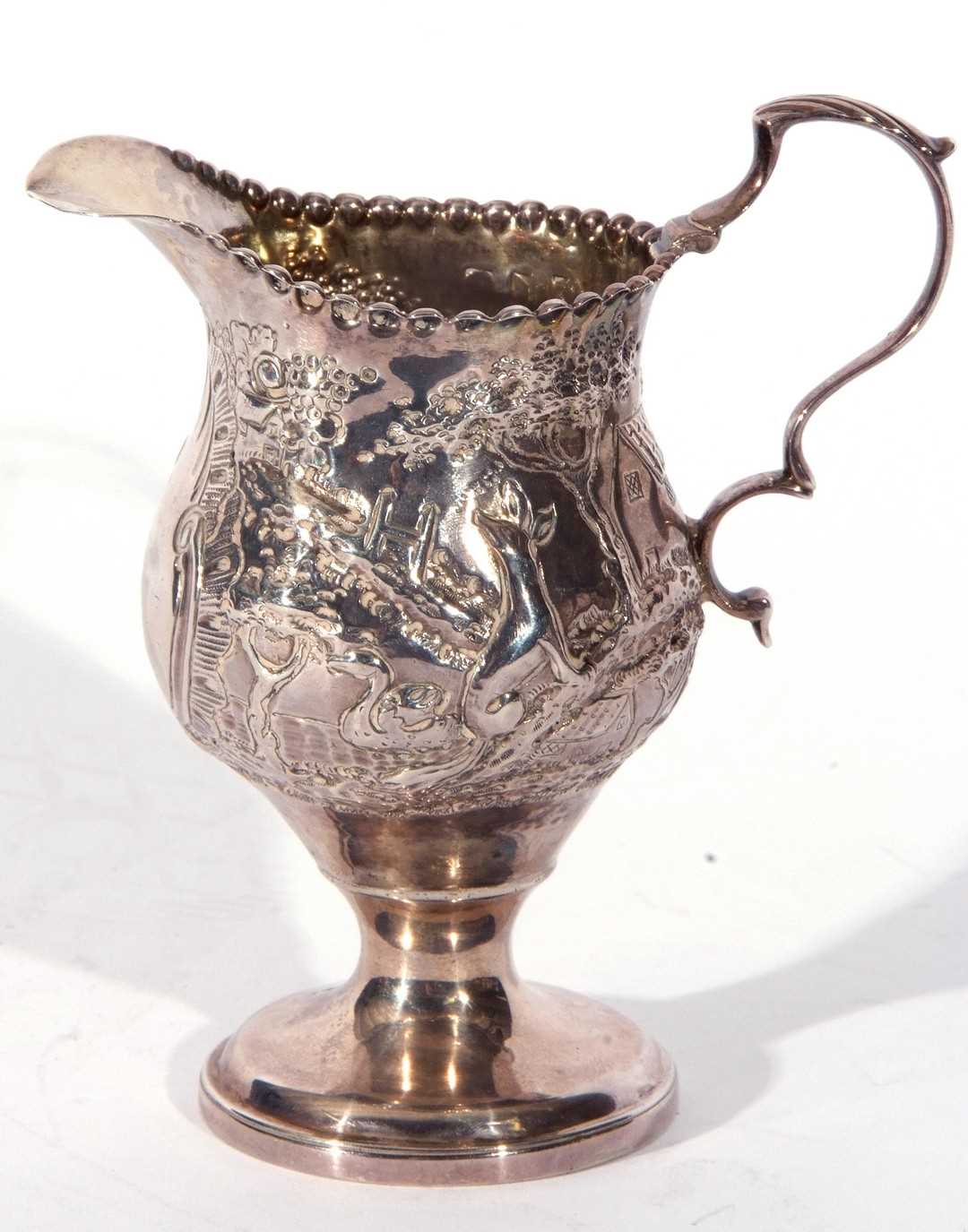 Lot 10 - George III silver cream jug of slender helmet...