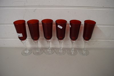 Lot 63 - SIX RUBY AND CLEAR GLASS CHAMPAGNE GLASSES