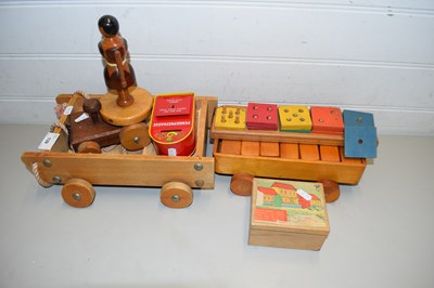 Lot 139 - TWO SMALL PULL ALONG TRUCKS OF CHILDRENS...