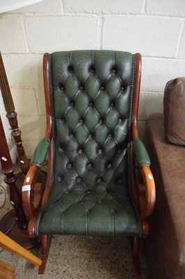 Lot 340 - GREEN LEATHER UPHOLSTERED ROCKING CHAIR