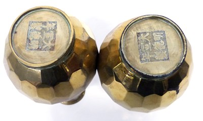 Lot 9 - A pair of Chinese brass vases of gours shape...