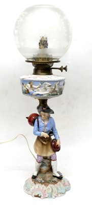 Lot 60 - Ceramic oil lamp with a continental figure in...