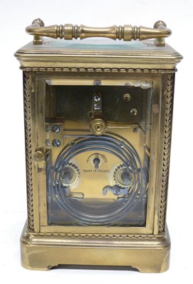 Lot 75 - Brass carriage clock with white enamal dial,...