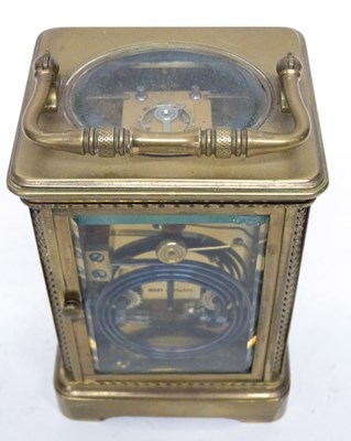 Lot 75 - Brass carriage clock with white enamal dial,...