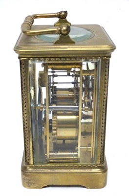 Lot 75 - Brass carriage clock with white enamal dial,...