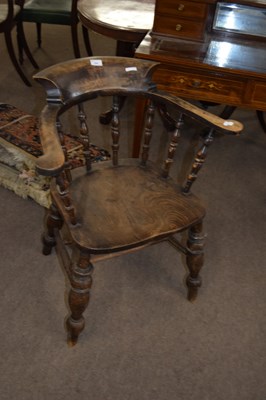 Lot 204 - Victorian elm seated bow back captains chair,...