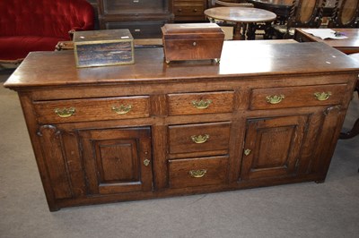 Lot 238 - Georgian oak dresser base fitted with two...