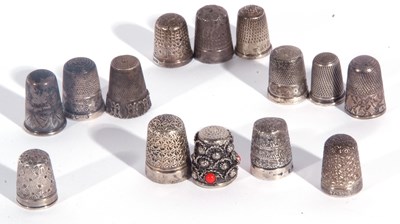 Lot 127 - Group of thimbles to include eight silver...