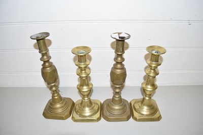 Lot 41 - TWO PAIRS OF BRASS CANDLESTICKS