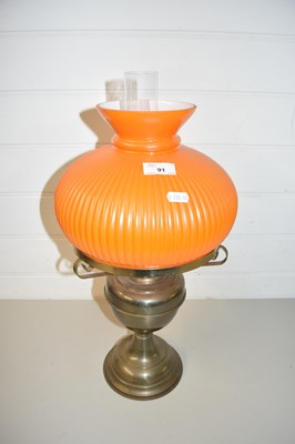 Lot 91 - OIL LAMP WITH ORANGE GLASS SHADE