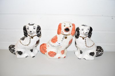 Lot 99 - THREE VARIOUS STAFFORDSHIRE DOGS