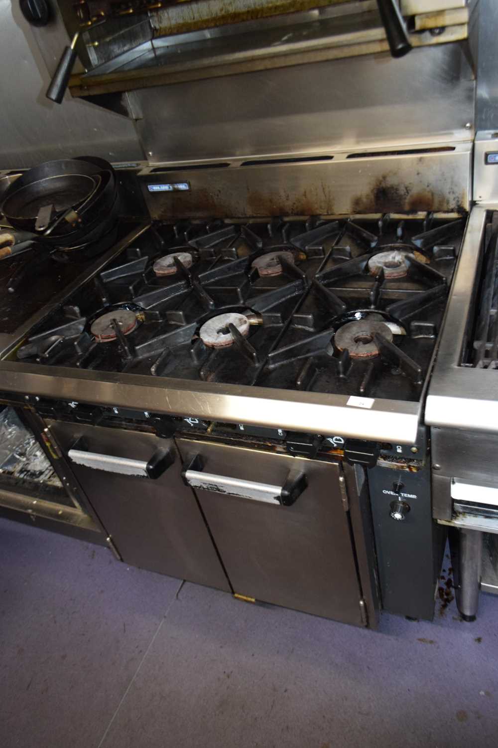 Lot 24 - Blue Seal six rung gas cooker with underneath...