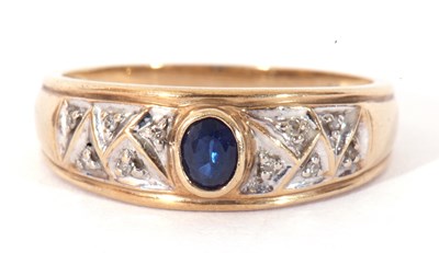 Lot 82 - Modern 375 stamped ring centring a bezel set...