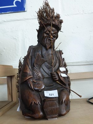 Lot 521 - 20TH CENTURY SOUTH EAST ASIAN CARVED WOODEN DEITY
