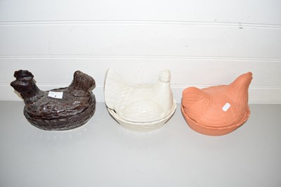 Lot 4 - THREE VARIOUS POTTERY HEN SHAPED EGG CONTAINERS