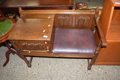 Lot 294 - OAK TELEPHONE SEAT WITH CARVED DECORATION