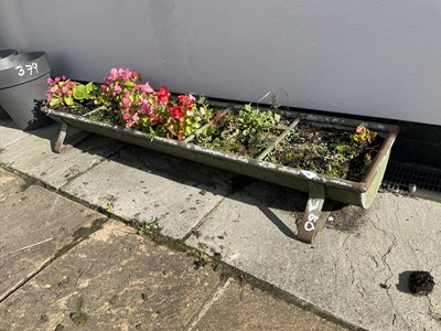 Lot 380 - Galvanised trough including contents, 135 cm x...