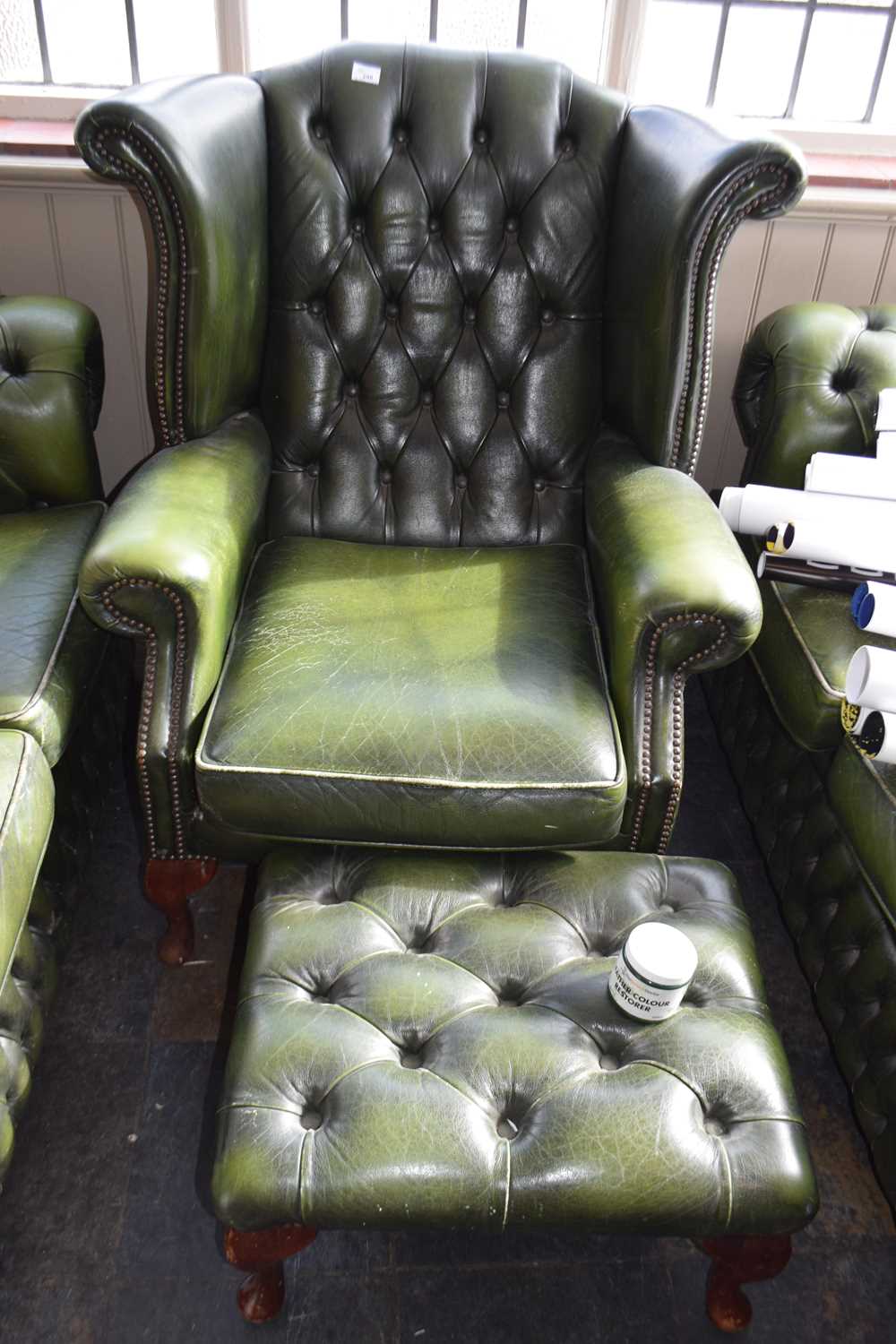 Lot 298 - Chesterfield style leather armchair with...