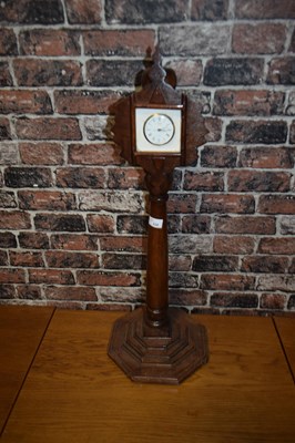 Lot 220 - Small mantel clock mounted on a turned wooden...