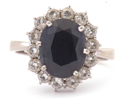 Lot 7 - 18ct white gold, dark sapphire and diamond...