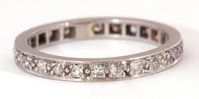 Lot 14 - Precious metal and diamond full eternity ring...